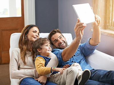 Buy stock photo Selfie, tablet and happy family relax in a home together doing social media content on the internet or online. App, website and parents with kid or child in happiness and smile for a picture