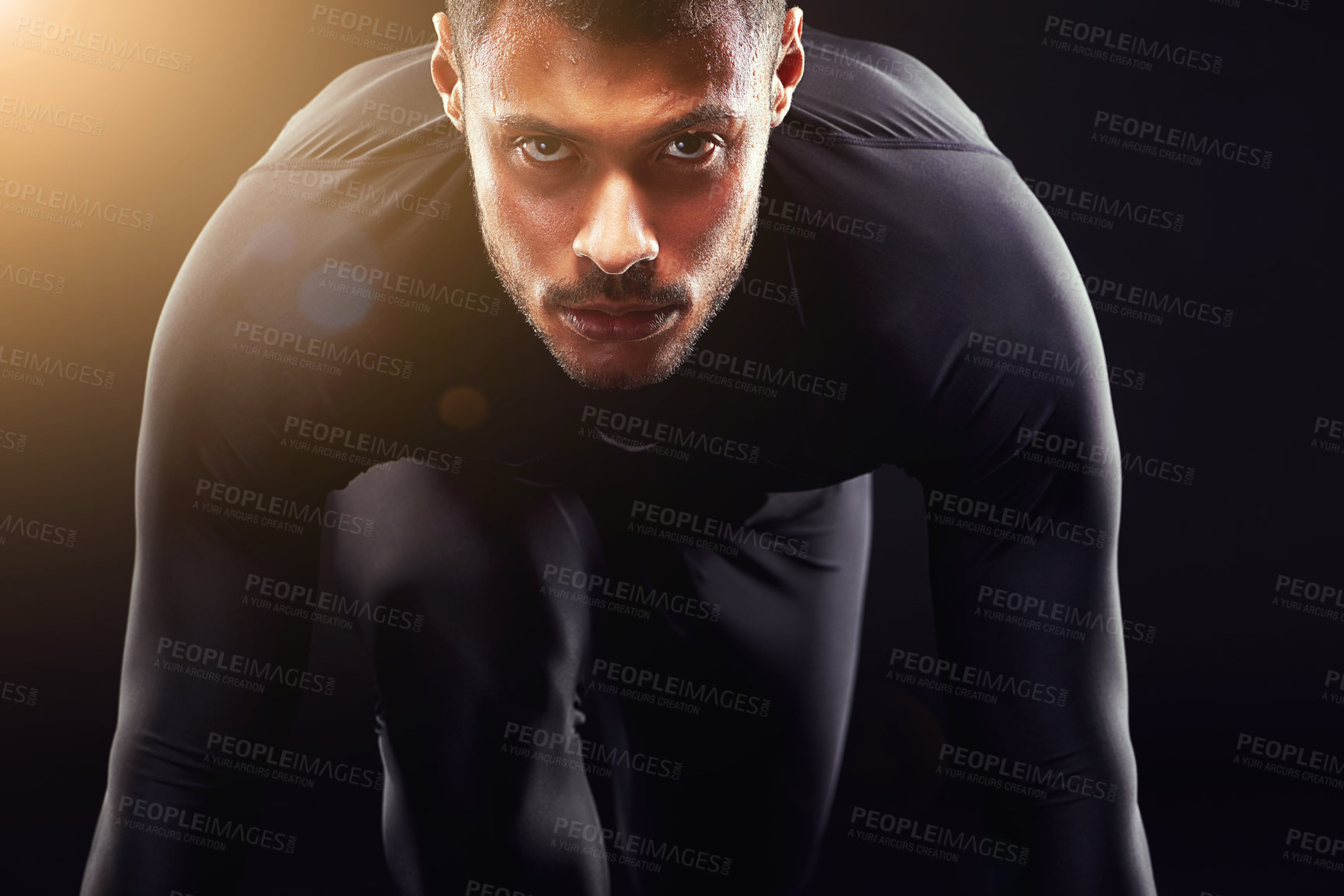 Buy stock photo Runner man, start and isolated portrait or run, race and intense focus in dark studio background. Serious, athlete and running training, cardio and fitness motivation to win, workout or exercise 