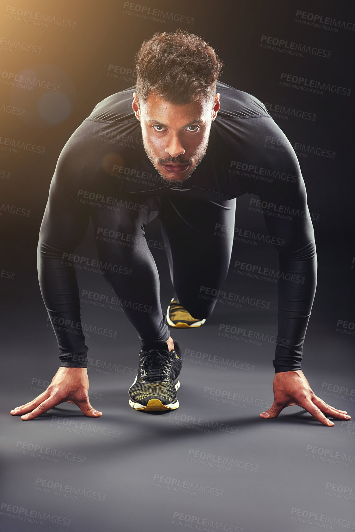 Buy stock photo Runner, portrait and man in studio with start, confidence and race challenge for health, wellness and power. Ready, running and strong athlete on black background for exercise, fitness or competition