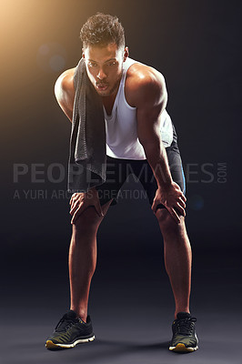 Buy stock photo Fitness, relax and man in studio with breathing, sweat and exhausted commitment to muscle workout. Air, rest and tired athlete on black background for exercise, towel and fatigue in morning training.