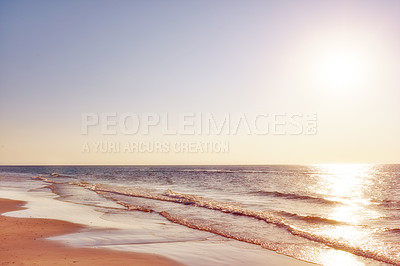 Buy stock photo Copy space, seascape and landscape of a golden sunset and sky on the coast of Jutland in Loekken, Denmark. Sun setting on an empty beach at dusk, over the ocean and sea in the evening with copyspace