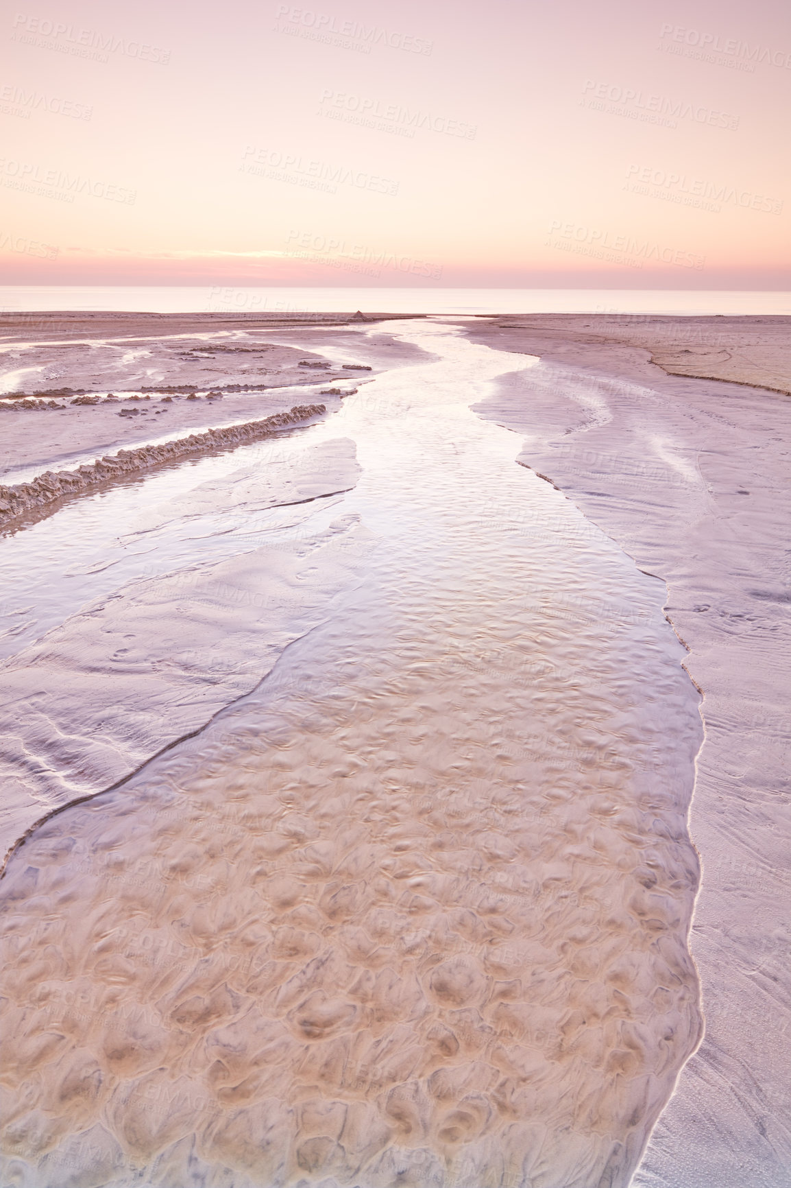 Buy stock photo Copyspace of sea and landscape of beautiful westcoast of Jutland in Loekken, Denmark. Sun setting on empty beach at dusk and over ocean and sea in the evening with copy space. Pink sky at the seaside