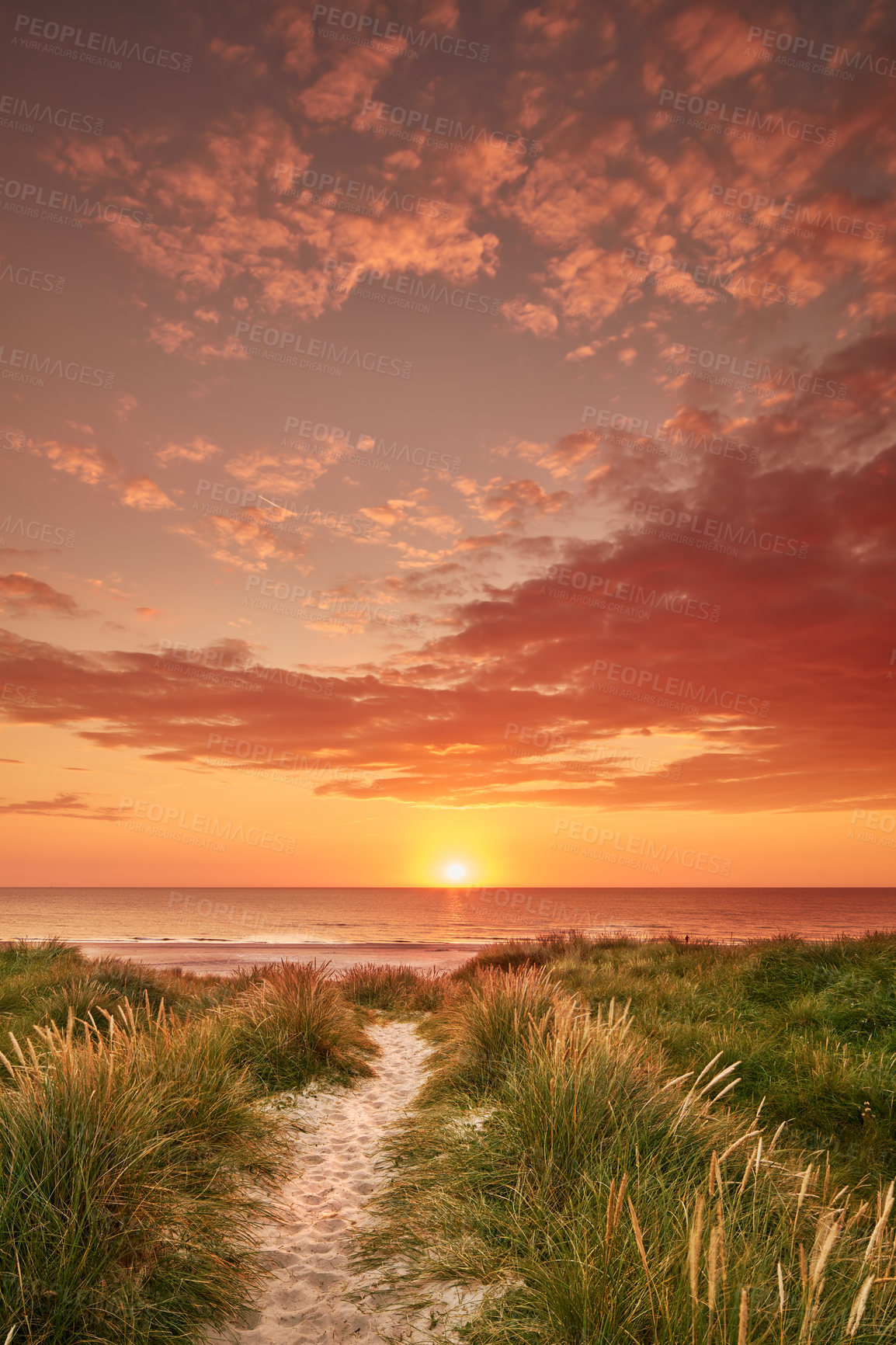 Buy stock photo Copyspace landscape of summer sunset on west coast of Sweden. Sun setting on horizon on an empty beach at dusk over ocean and sea at night. Sunrise in morning. Cloudscape of an orange sky at seaside