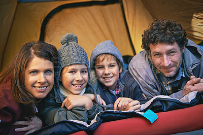 Buy stock photo Portrait, happy family and camping in tent on holiday, vacation or travel together. Face, parents and smile of children at campsite for kids bonding to relax with mother and father on adventure trip