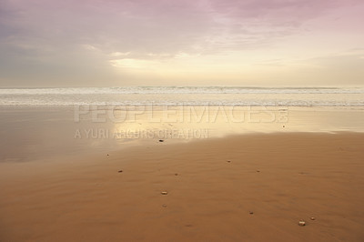 Buy stock photo Seascape and landscape of a golden sunset on the west coast of Jutland in Loekken, Denmark. Beautiful cloudscape on an empty beach at dusk. Clouds over the ocean and sea in the evening with copyspace