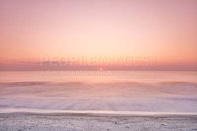 Buy stock photo Beautiful sunset at the beach for a vacation destination. Sunrise with a clear sky and sun rays at the ocean. Coastline landscape with great scenery on a summer day. 