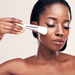Setting a flawless foundation for her makeup regimen