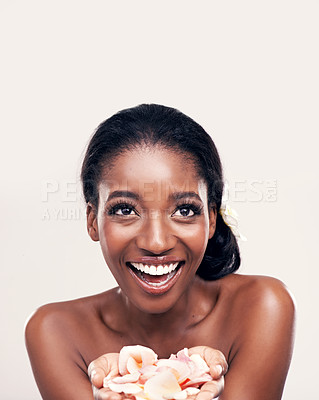 Buy stock photo Petal, skincare and black woman laugh in studio for makeup, beauty or wellness on white background. Floral, face and African model smile with soft cosmetics, shine or organic, fun and transformation