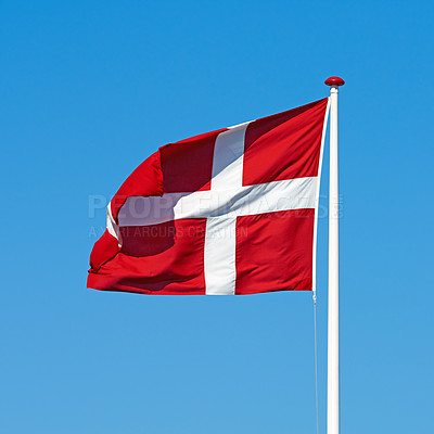 Buy stock photo Denmark, flag and wind on sky background with icon, pride and protocol at kingdom. Symbol, nationalism and international identification in Scandinavia with royalty, representation and space.