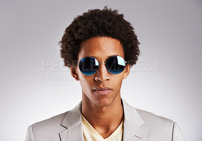 Buy stock photo Portrait, business and sunglasses with black man in studio on gray background for career, fashion or style. Face, job and suit with confident young employee or model in shades for professional work