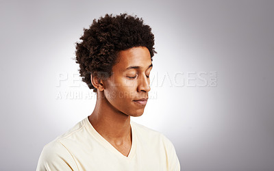 Buy stock photo Anxiety, mental health and tired black man in studio with exhaustion, burnout or broken heart. Sad, depression and African male person with loneliness, worry or grief isolated by gray background.