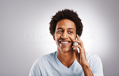 Buy stock photo Phone call, smile and happy man in studio with mockup for gossip, news or web communication on grey background. Smartphone, listen and African model with networking, chat or streaming app connection