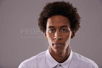 Buy stock photo Portrait, afro and business with young black man in studio on gray background for professional career. Company, face or serious and confident employee at work with attitude or mindset of ambition