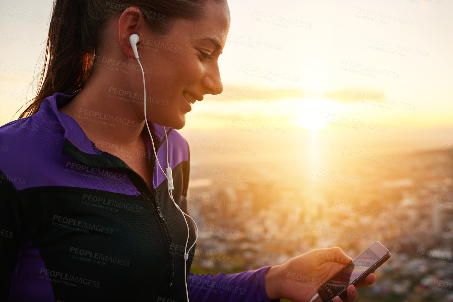 Buy stock photo Happy woman, fitness and earphones with phone in sunset for music, podcast or listening to audio in nature. Female person or runner with smile for streaming, sound or radio player during exercise