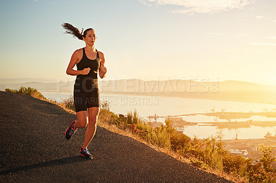 Buy stock photo Fitness, running and woman on cliff at sunset for health, wellness and strong body development. Workout, exercise and girl runner on path in nature for marathon training, performance and challenge.
