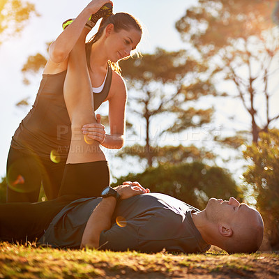Buy stock photo Nature, help and couple stretching for fitness, workout coach and physio for healthy body. Exercise, wellness and woman with man in muscle warm up for outdoor training in morning on forest ground.