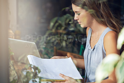 Buy stock photo Student, woman and notebook in cafe for study, knowledge and education with notes, laptop or scholarship. Young person, learning or research in books for assignment, assessment or exam in coffee shop