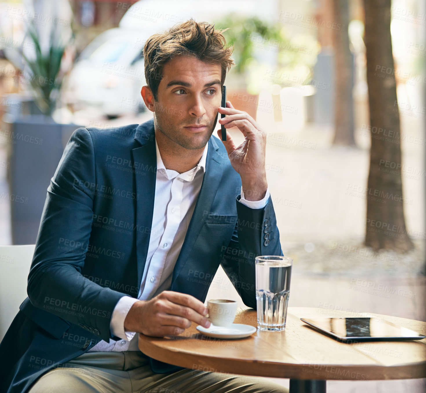 Buy stock photo Businessman, mobile or call as thinking, coffee or discussion of tech, startup or company vision. Man, phone or idea of planning, corporate or communication in work break at outdoor cafe in Colombia