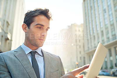 Buy stock photo Serious, tablet and businessman in city networking on social media, mobile app or the internet. Career, research and professional male lawyer reading blog on website with digital technology in town.