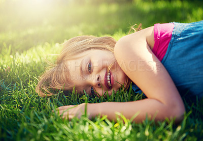 Buy stock photo Shot of a little girl having fun on the lawn