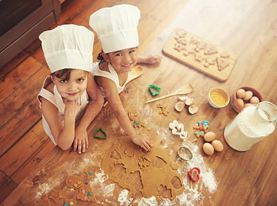 Buy stock photo Cooking, baking and children in a kitchen learning independence as happy young bakers or siblings at home. Development, playful girls or fun kids enjoy making cookies with milk, eggs or flour recipe