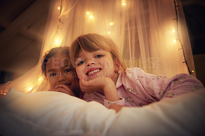 Buy stock photo Shot of two cute little girls having a sleepover