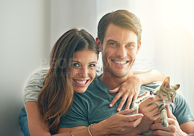 Buy stock photo Man, woman and kitten for portrait in home with hug for love, bonding and care for pet in living room. Couple, relax or pride with kindness, embrace and cat in lounge for animal adoption at house