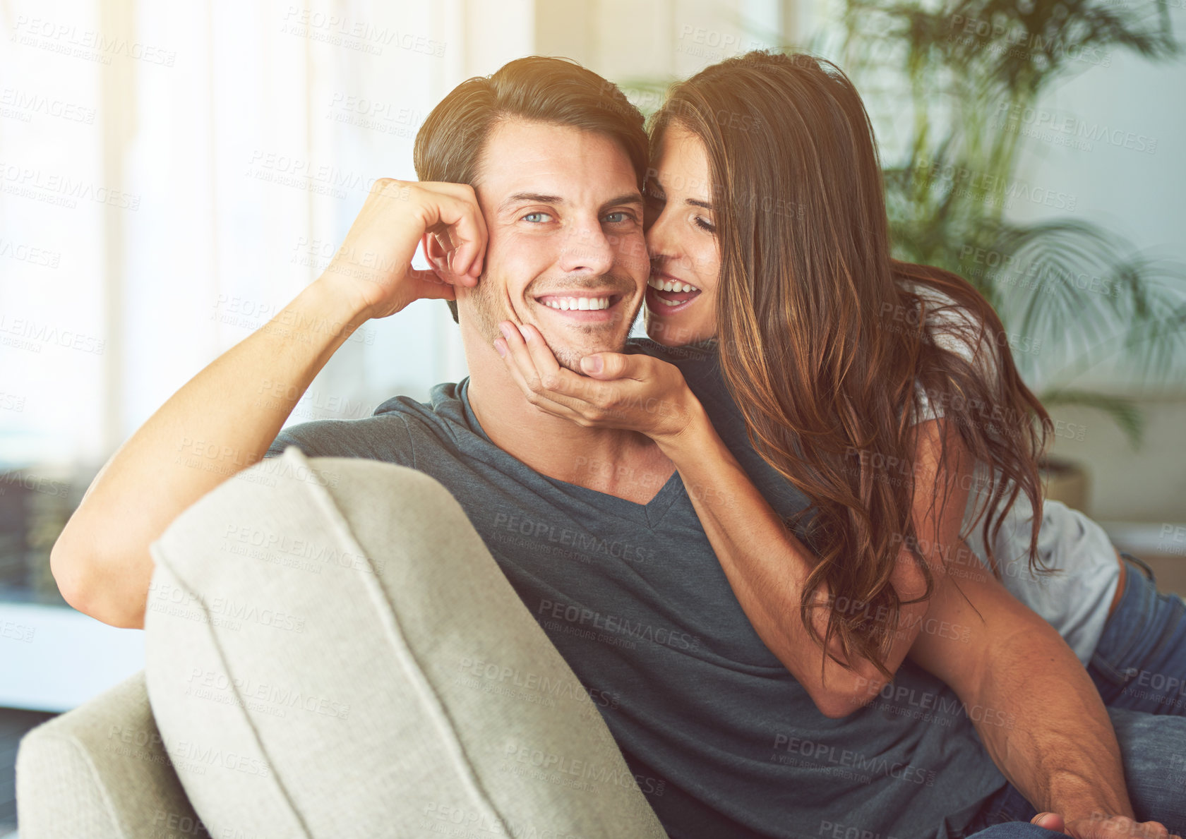 Buy stock photo Smile, portrait and couple relaxing on sofa for bonding in living room at apartment together. Happy, resting and young man and woman laying on couch for romance and marriage in lounge at modern home.