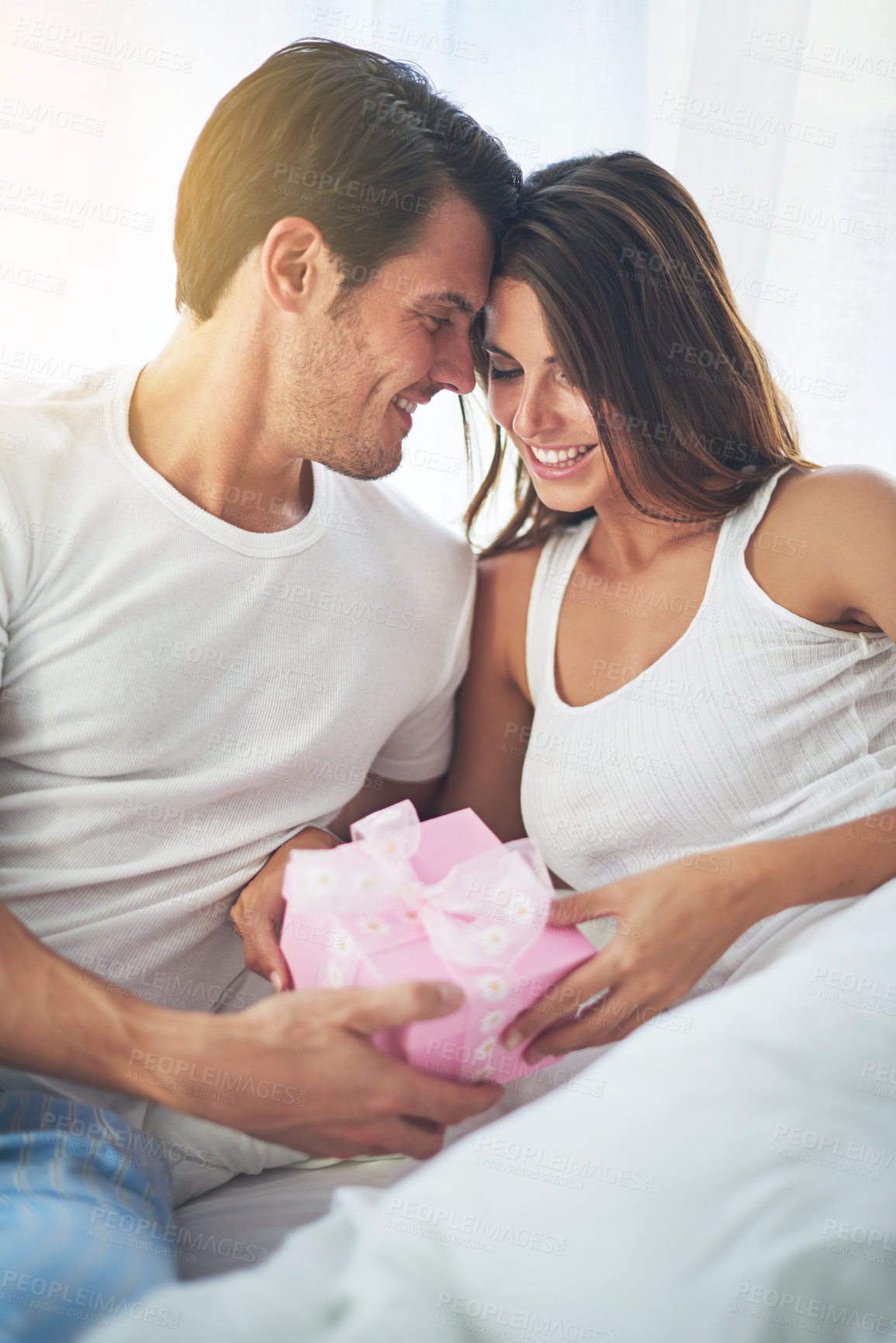 Buy stock photo Man giving woman gift, love and happy with partnership, relationship and celebration on Valentines day date. Couple smile with present, luxury and commitment, gratitude and celebrate holiday