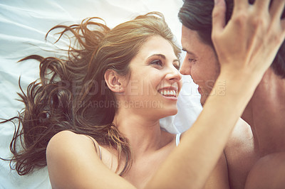 Buy stock photo Affection, intimate and couple bonding in bedroom for caring, love and celebration of honeymoon. Relax, happy and funny man and woman being affectionate on anniversary, valentines day or date in bed