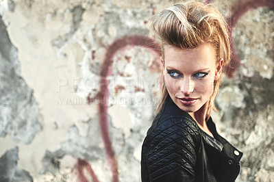 Buy stock photo Cropped shot of an edgy young woman in an urban setting