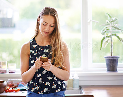 Buy stock photo Woman, kitchen and cooking with cellphone for recipe, online and blog for food preparation. Home, smartphone and read for female person, digital and internet for mobile app on social media in house