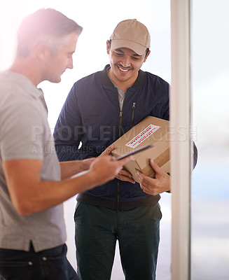 Buy stock photo Shot of a courier making a delivery to a smiling customer