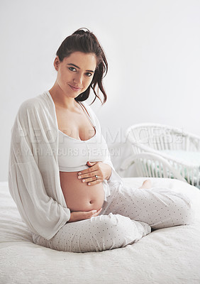 Buy stock photo Portrait, pregnant and woman on a bed, maternity leave and happiness with rest, relax and healthy. Face, female person and mother touching stomach, pregnancy and lady in a bedroom and break at home