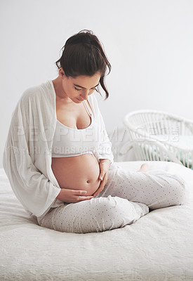 Buy stock photo Shot of a pregnant woman at home