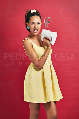 Buy stock photo Woman, portrait and baker with electric mixer for ingredients or desert on a red studio background. Young female person or ready with home appliance for baking, mixing or hospitality in yellow dress