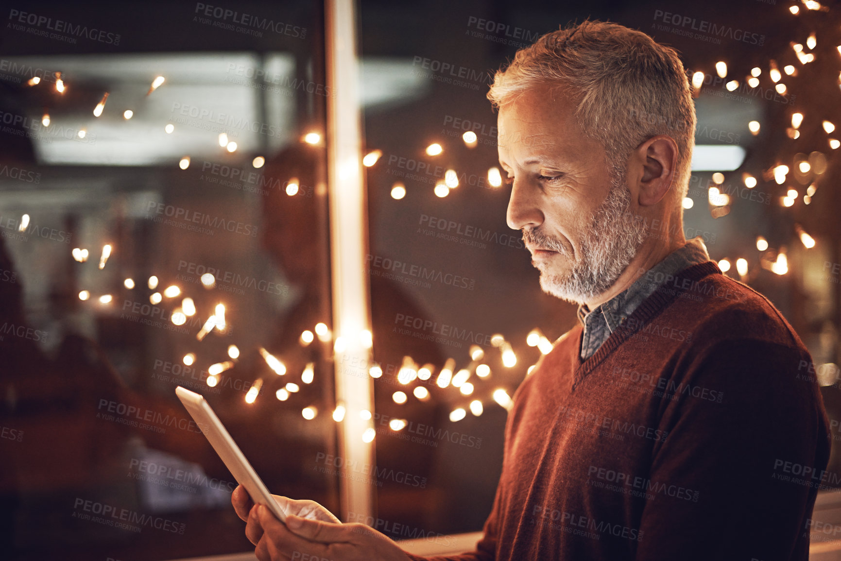Buy stock photo Night, research and mature businessman with tablet for reading, website review or online report for business opportunity. Networking, communication and man at work with digital app in dark office
