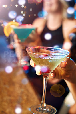 Buy stock photo Hand, cocktail and nightclub with a woman at a bar for drinking, fun or new year celebration closeup. Party, birthday and glass with a female enjoying a drink while clubbing for weekend nightlife