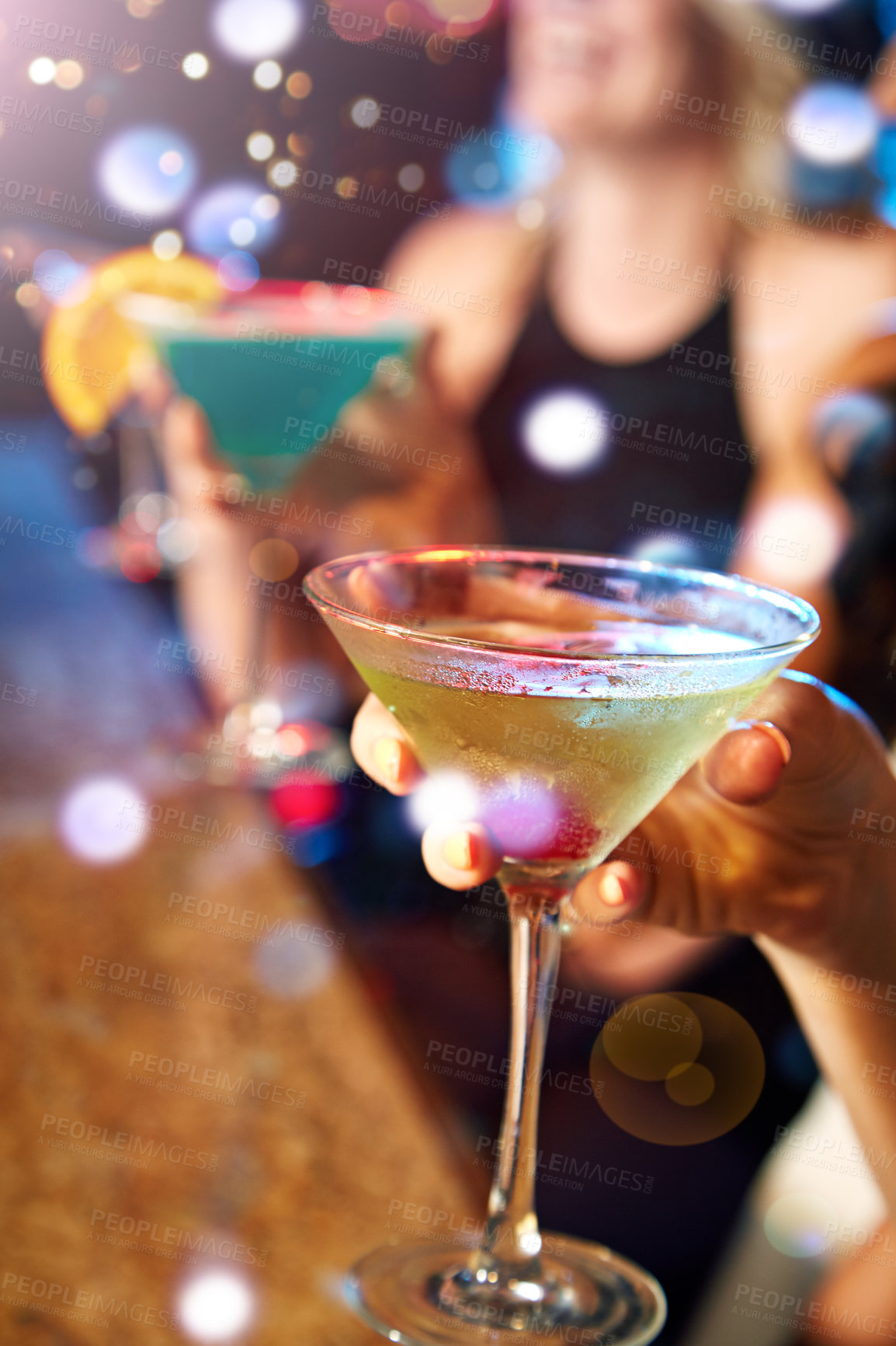 Buy stock photo Hand, cocktail and nightclub with a woman at a bar for drinking, fun or new year celebration closeup. Party, birthday and glass with a female enjoying a drink while clubbing for weekend nightlife