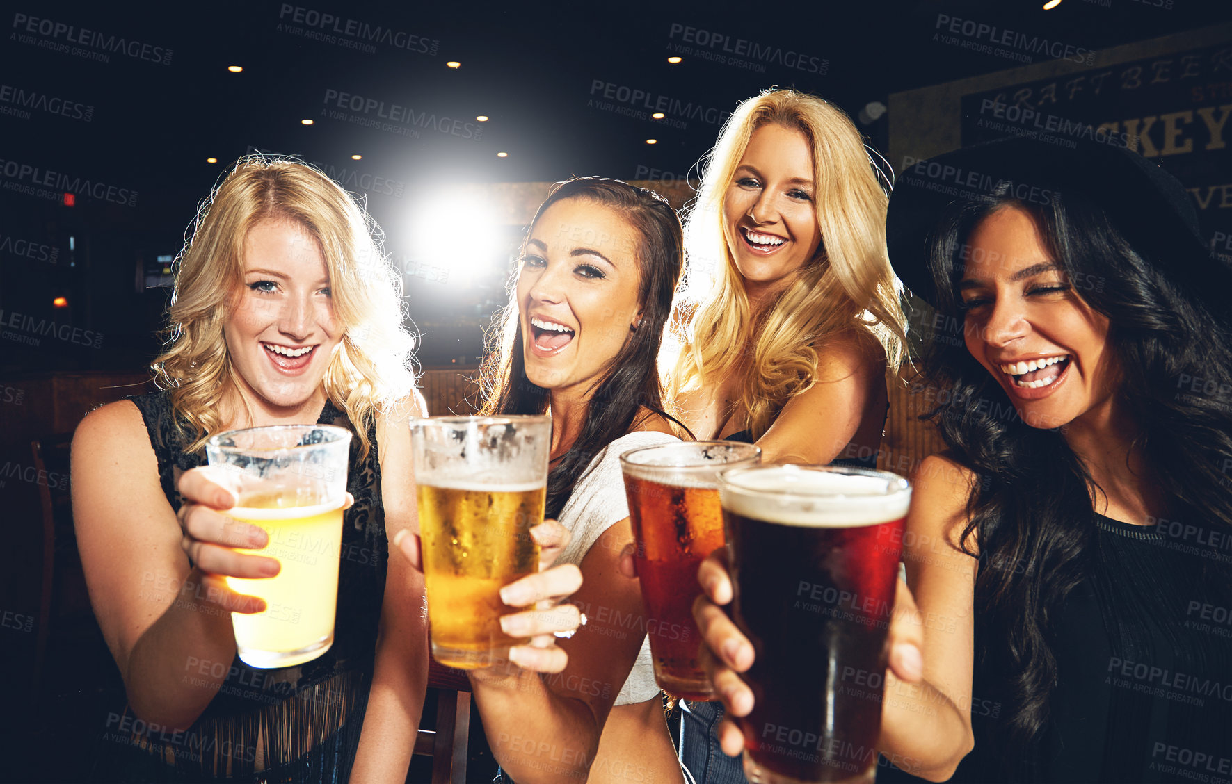 Buy stock photo Shot of young women partying in a nightclub