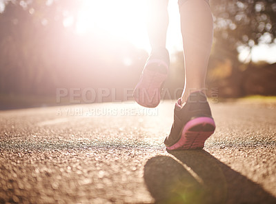 Buy stock photo Cropped shot of a woman's legs out for a run