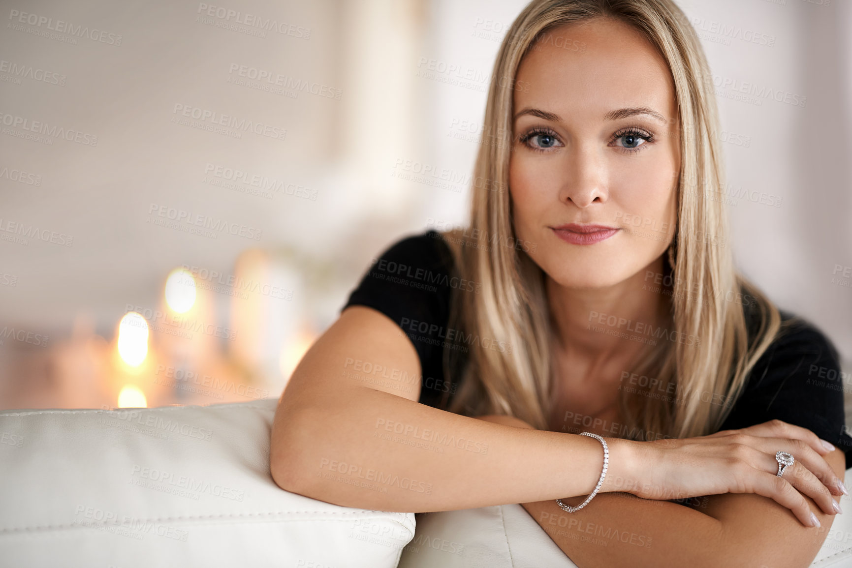 Buy stock photo Portrait, serious woman and relax on couch, wellness and confidence of freelancer in living room. Face, pride and entrepreneur with candles in lounge, mindfulness and remote job with peace in house