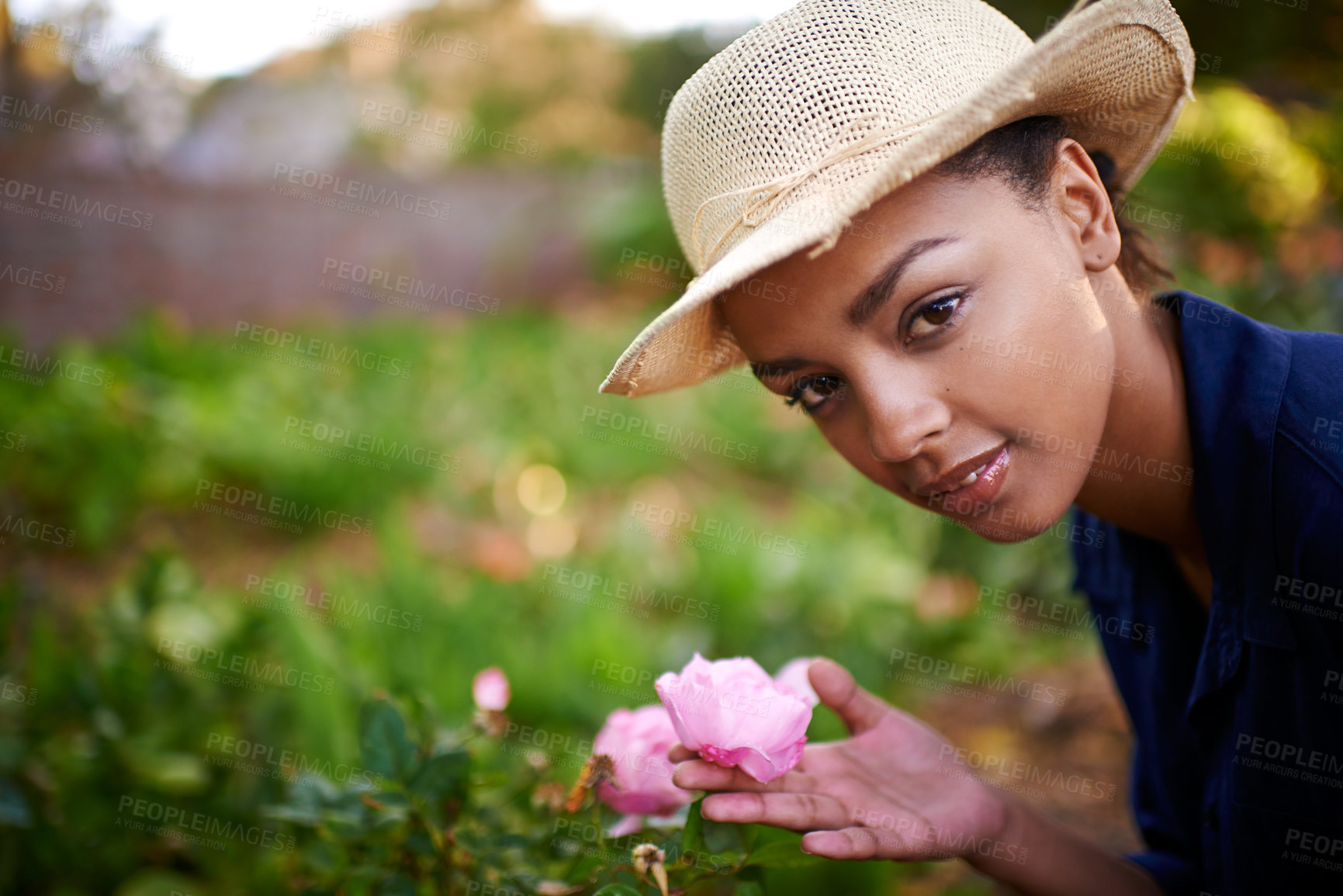 Buy stock photo Nature, flowers and portrait of woman gardening for sustainable planting of roses in park. Growth, outdoor and female botanist with pink floral blooming for eco friendly environment in countryside.