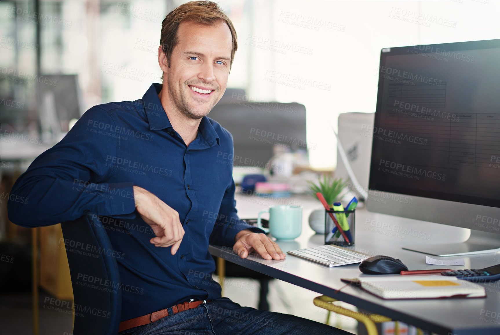 Buy stock photo Portrait of a designer sitting at his desk in an office