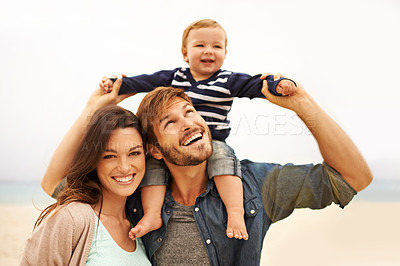 Buy stock photo Cropped shot of a young couple and their son at the beach