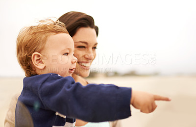 Buy stock photo Happy mother, beach and baby pointing for fun bonding, holiday or outdoor weekend together in nature. Face of mom, little boy or toddler with smile, enjoying sightseeing or travel by the ocean coast
