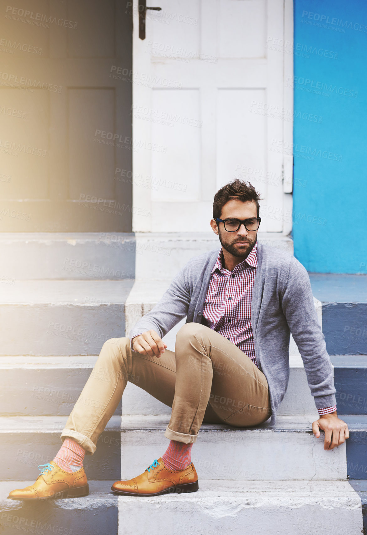 Buy stock photo Man, building and serious on stairs for fashion, clothes and trendy with glasses outdoor in Cape Town, South Africa. Male person, gen z guy and vision for unique outfit, garment and urban style 