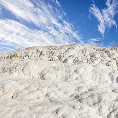 Buy stock photo Scenic view of travertine terraces in Pamukkale Turkey. Crystallised calcium formations formed by thermal spring water at the spa in Hierapolis. Popular tourist location and travel destination abroad