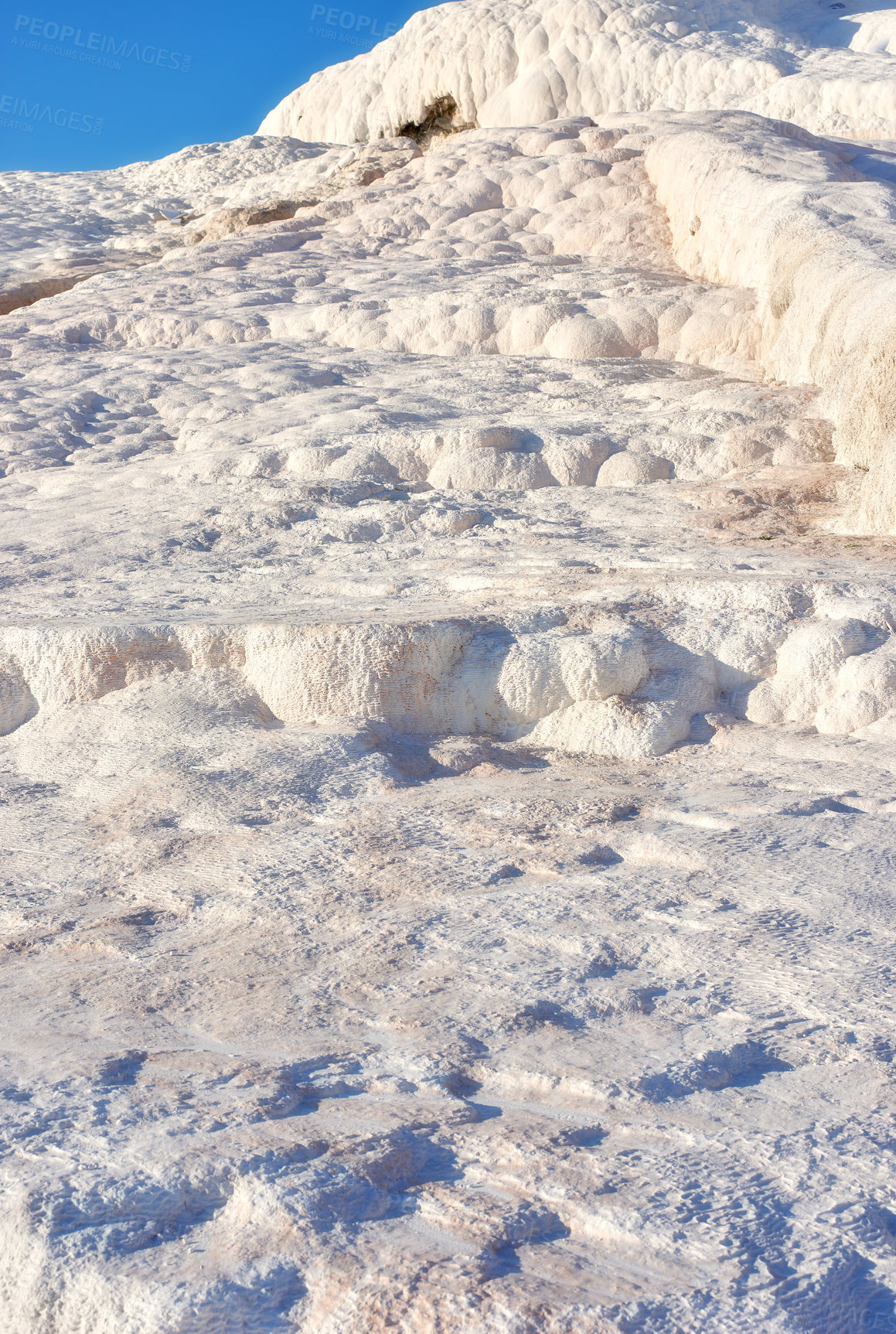 Buy stock photo Closeup of travertine pools and terraces in Pamukkale, Turkey. Travelling abroad for holiday and tourism. Cotton castle area with carbonate mineral after flowing thermal spring water