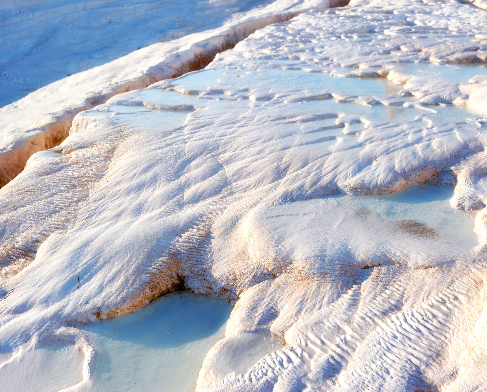 Buy stock photo Closeup of travertine pools and terraces in Pamukkale, Turkey. Traveling abroad for vacation and tourism. Cotton castle area with carbonate mineral after flowing thermal spring water from above